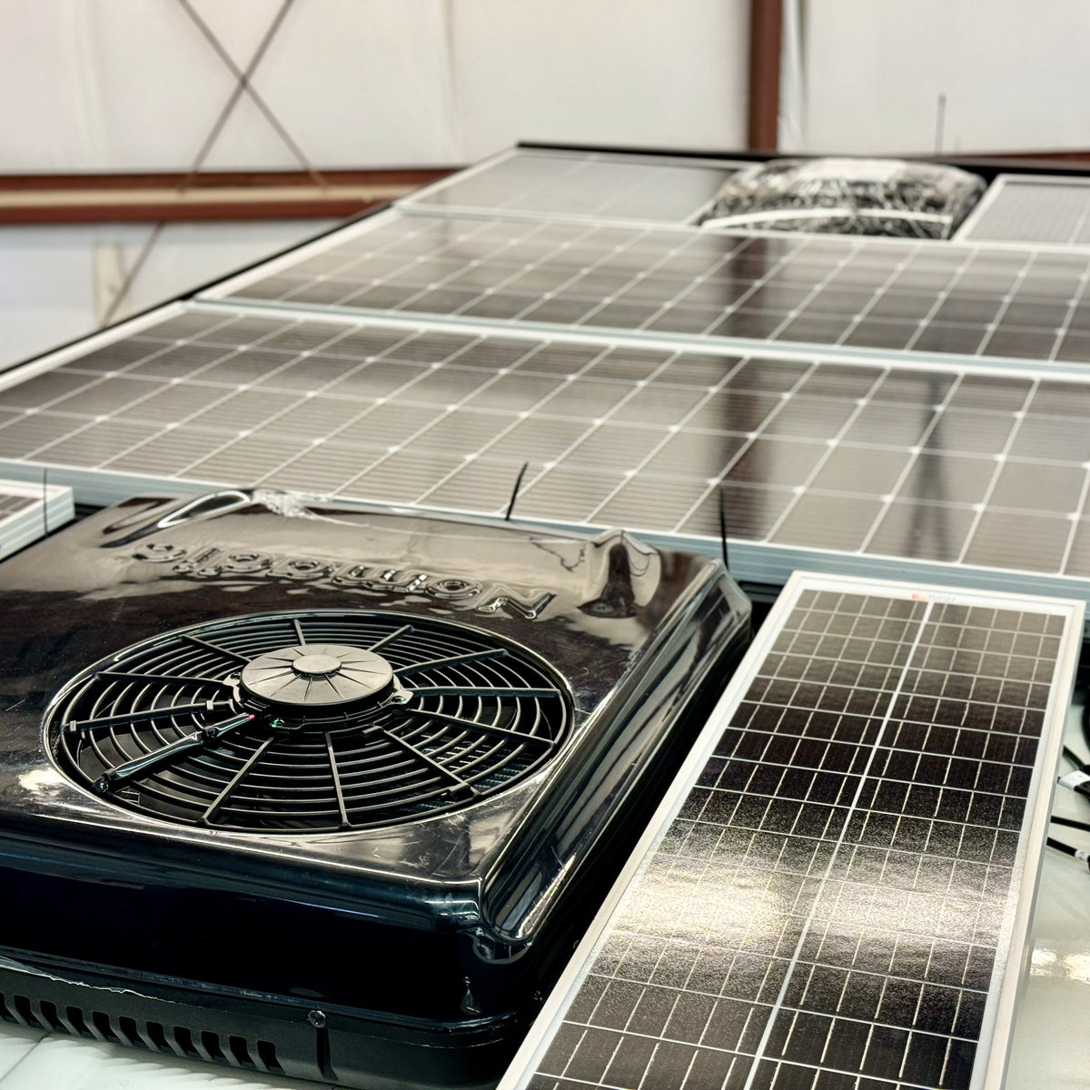Solar panels and rooftop air conditioner